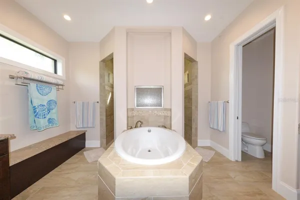 a bathroom with a sink a mirror and a bathtub