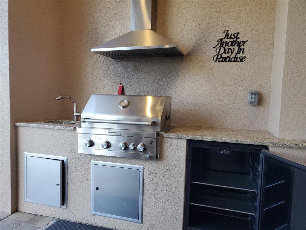 185 Colony Point Drive Punta Gorda, FL 33950 - Photo 37 of 54 a stove top oven sitting inside of a kitchen