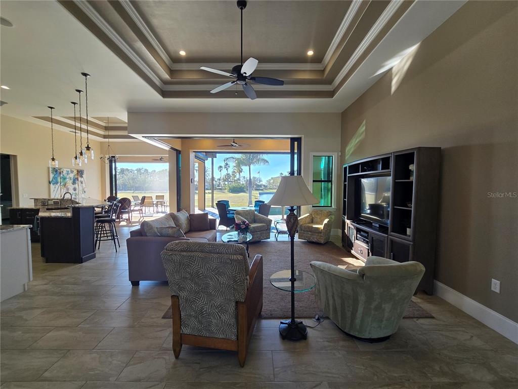 185 Colony Point Drive Punta Gorda, FL 33950 - Photo 38 of 54 a living room with furniture and a flat screen tv