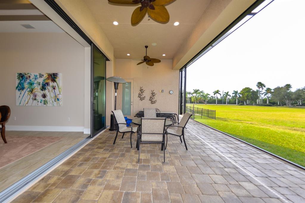 185 Colony Point Drive Punta Gorda, FL 33950 - Photo 41 of 54 a dining room with furniture and a floor to ceiling window