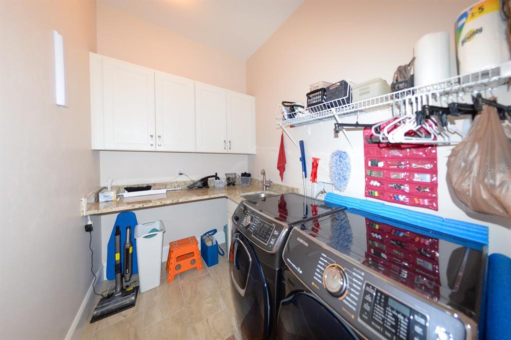 185 Colony Point Drive Punta Gorda, FL 33950 - Photo 46 of 54 a utility room with stainless steel appliances wooden floor and window