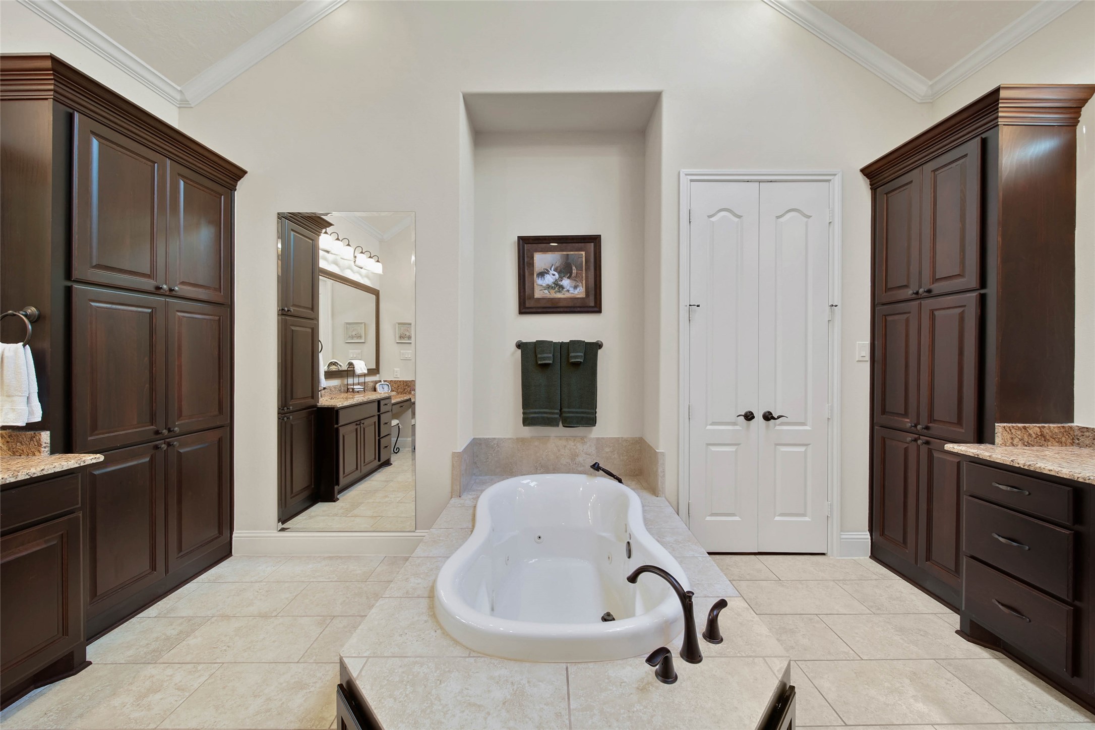 3234 Explorer Way Conroe, TX 77301 - Photo 29 of 46 Spa-inspired bath includes a soaking and jetted tub, separate vanities, and generous storage. Dual linen closets maximize storage space!
