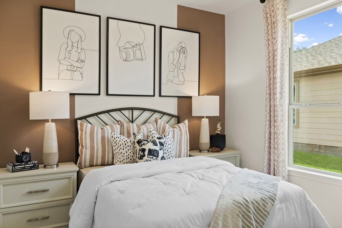 25610 White Vortex Drive Spring, TX 77373 - Photo 2 of 12 Secondary bedroom features plush carpet, neutral paint, lighting, large window, and an ample spaced closet.