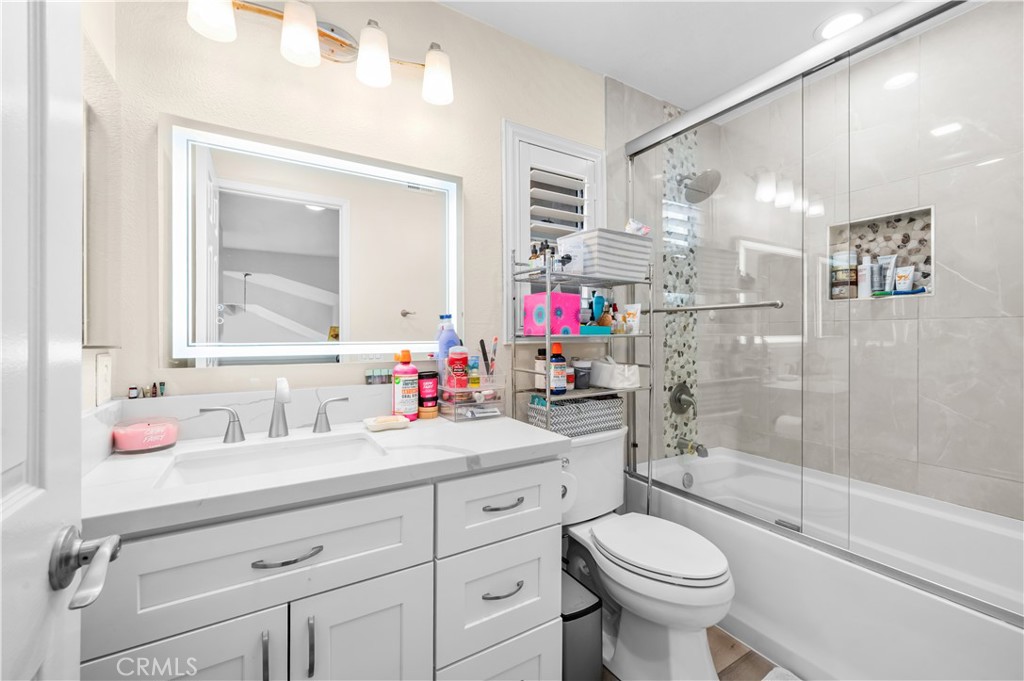19465 Kinnow Lane Riverside, CA 92508 - Photo 35 of 61 a bathroom with a sink toilet and shower