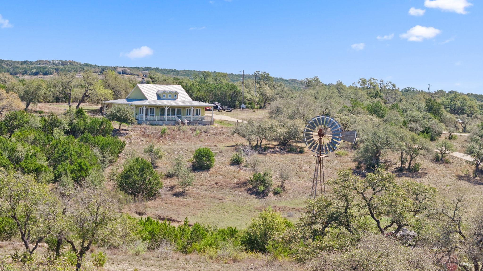 6350 Mt Sharp Road, Unit B Wimberley, TX 78676 - Photo 29 of 34 a view of a lake with a mountain in the background