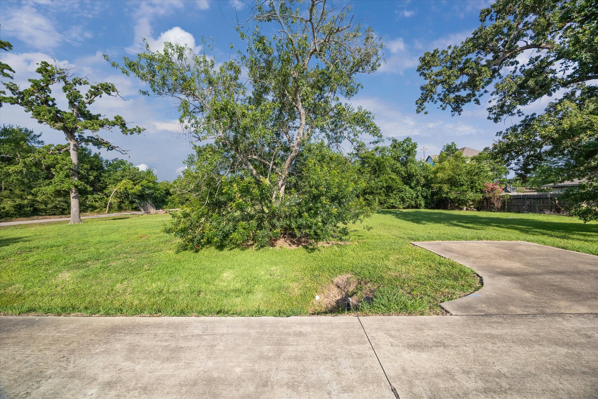 3410 Byway Avenue Shoreacres, TX 77571 - Photo 4 of 12 a view of a garden with a fountain