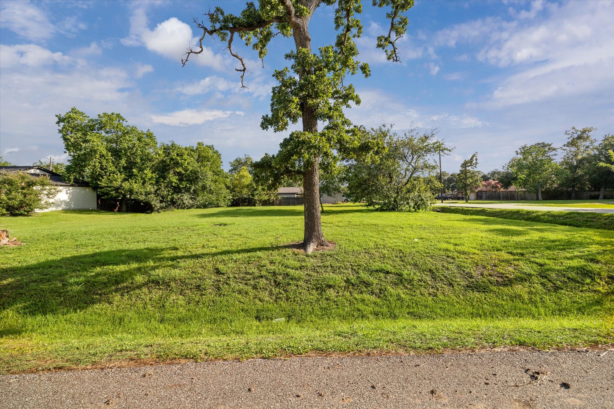 3410 Byway Avenue Shoreacres, TX 77571 - Photo 9 of 12 a view of an ocean with a big yard and large trees