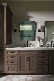 a bathroom with a double vanity sink and a mirror