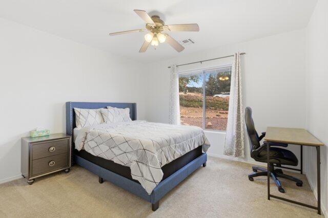 722 Boulder Ridge Road Payson, AZ 85541 - Photo 25 of 29 a bedroom with a bed and a window