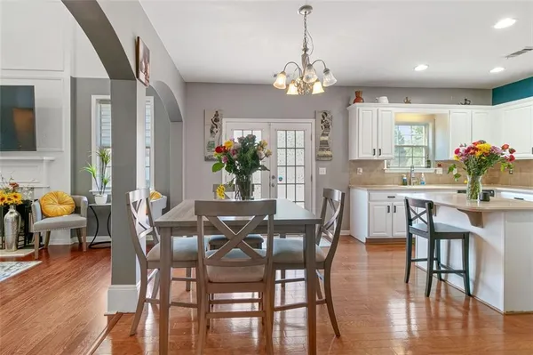 a view of a dining room with furniture window and wooden floor