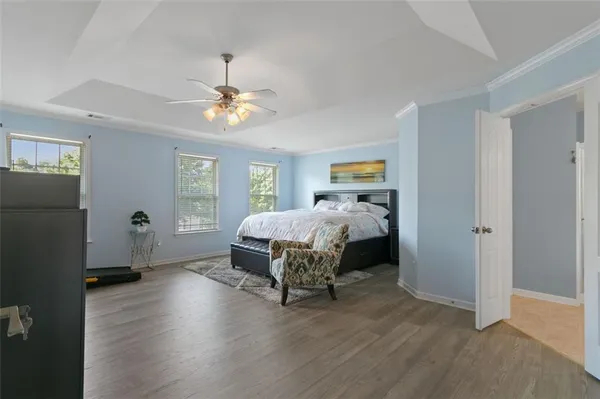 a bedroom with bed and a window