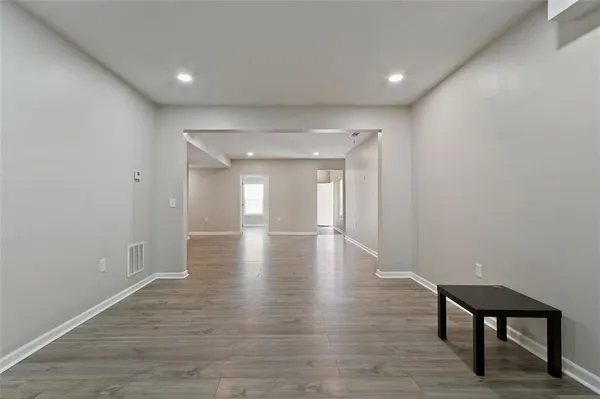 a view of gallery with wooden floor
