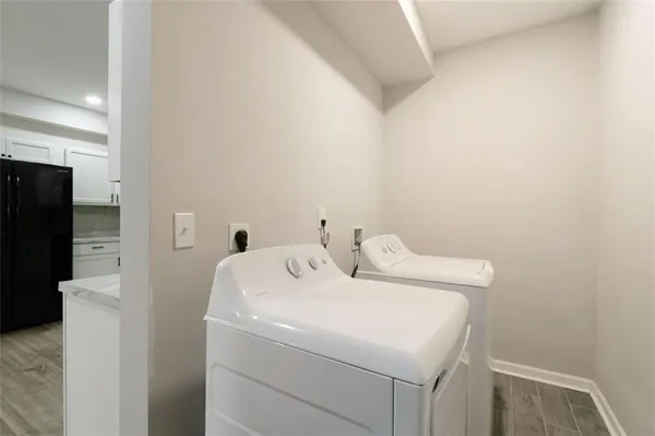 a utility room with dryer and washer