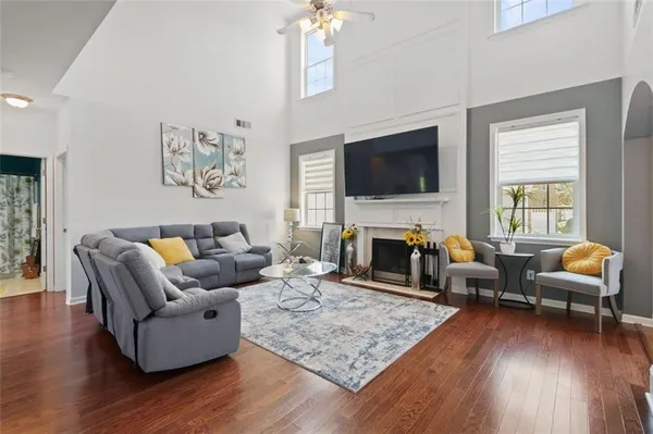 a living room with fireplace furniture and a flat screen tv