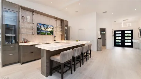 a view of walk in closet with clothes