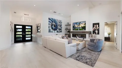 a bedroom with bed and painting on the wall