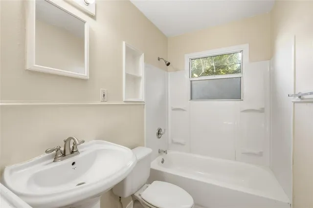 a bathroom with a sink toilet and bathtub