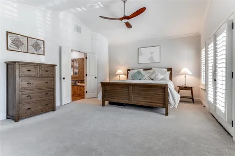 a bedroom with furniture and a window