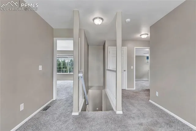 a view of a room with a furniture and entryway