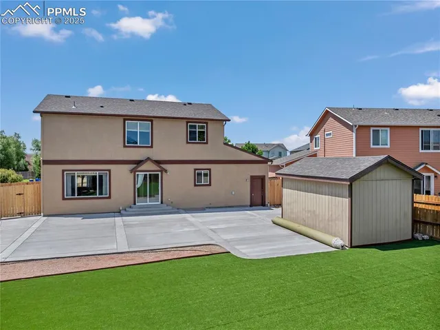 an aerial view of a house with a garden