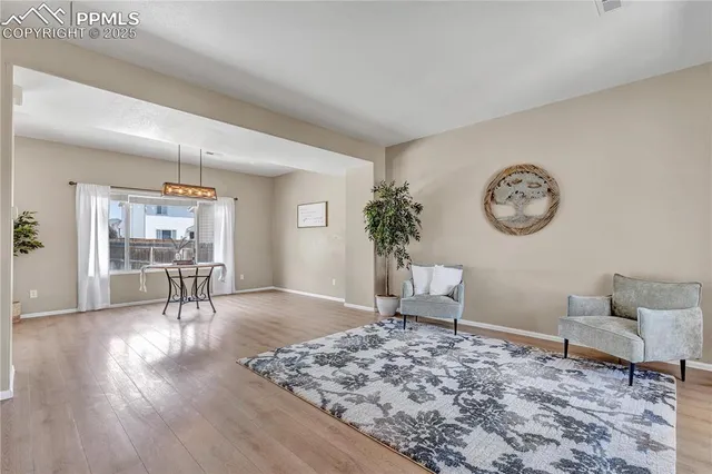 a living room with furniture and a table