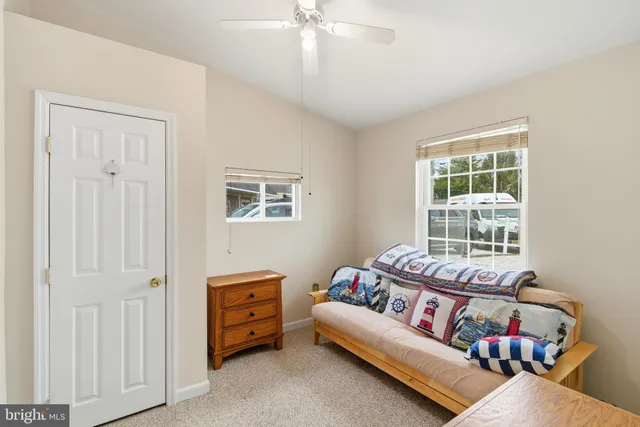 a bed room with a bed and a window