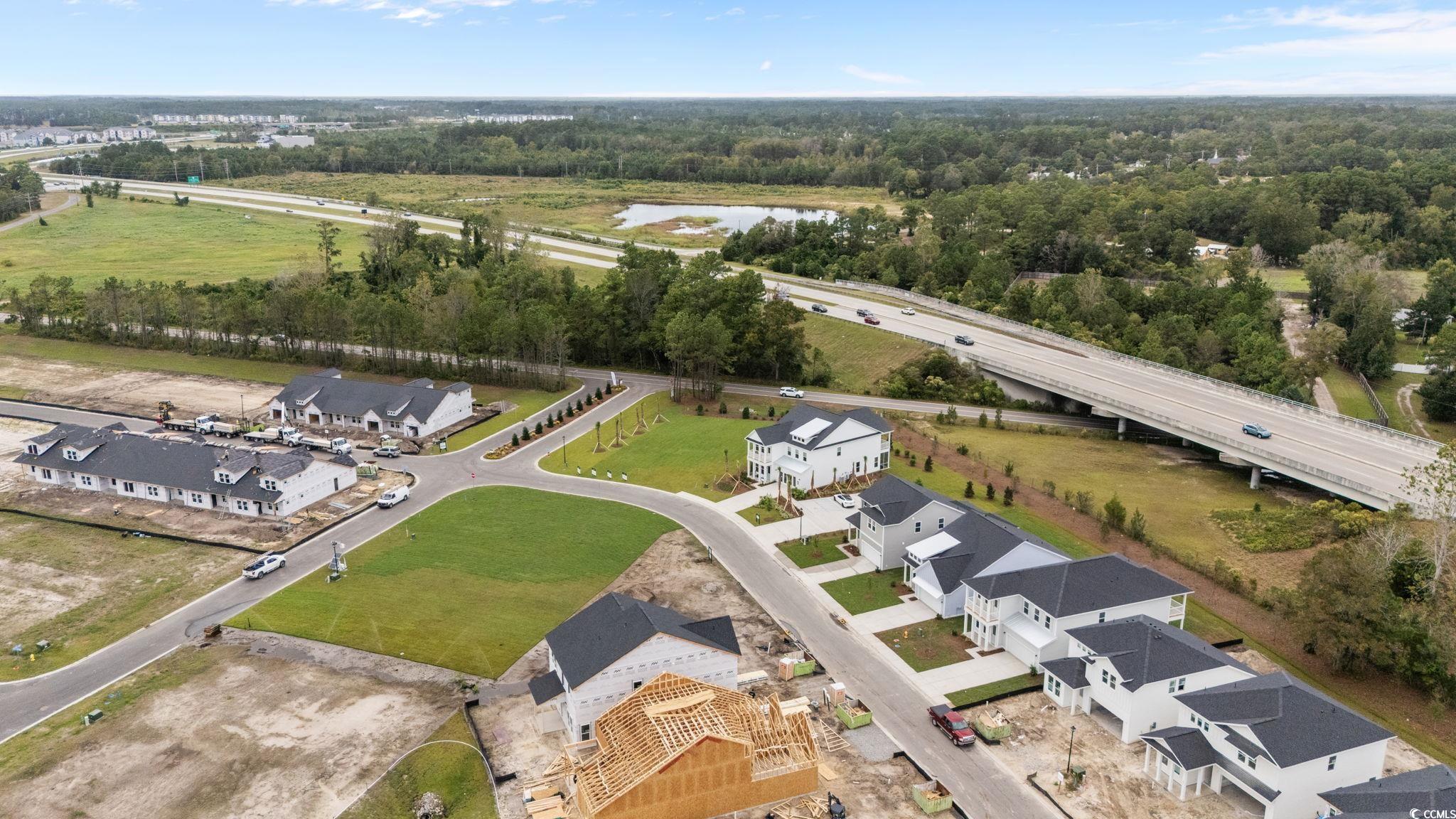 771 Ebb Tide Road Little River, SC 29566 - Photo 11 of 35 Aerial perspective of suburban area with a major roadway