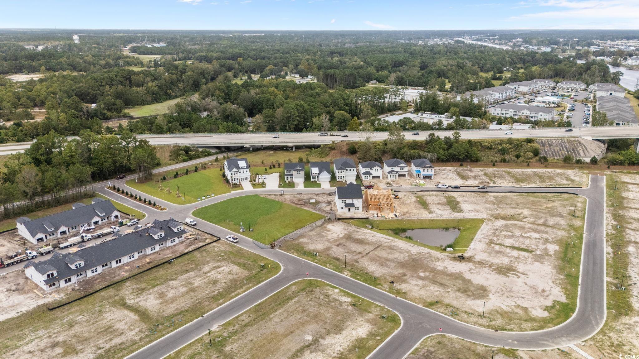 771 Ebb Tide Road Little River, SC 29566 - Photo 12 of 35 Aerial view of property and surrounding area with nearby suburban area
