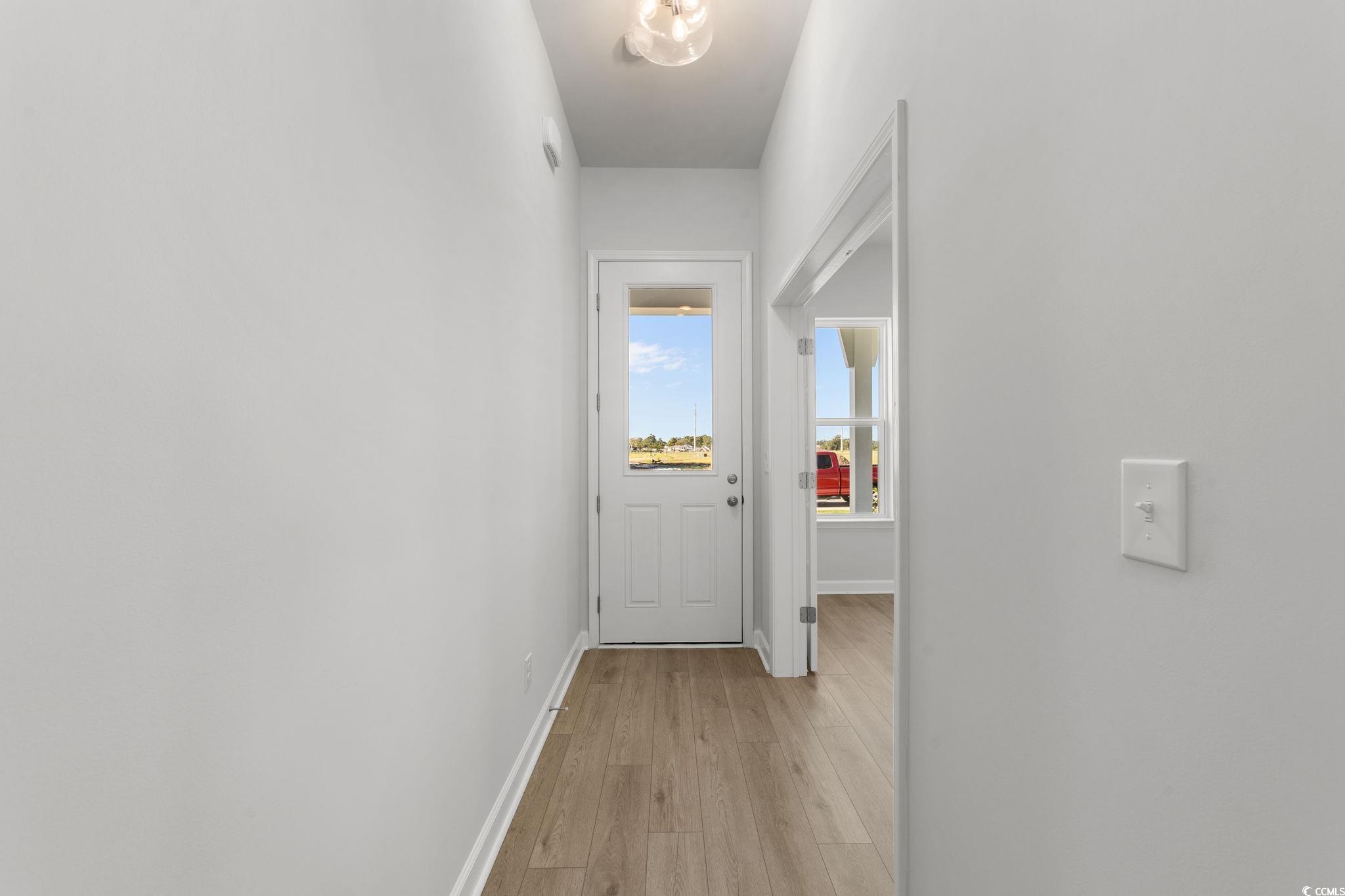 771 Ebb Tide Road Little River, SC 29566 - Photo 13 of 35 Hall featuring baseboards and light wood-style floors