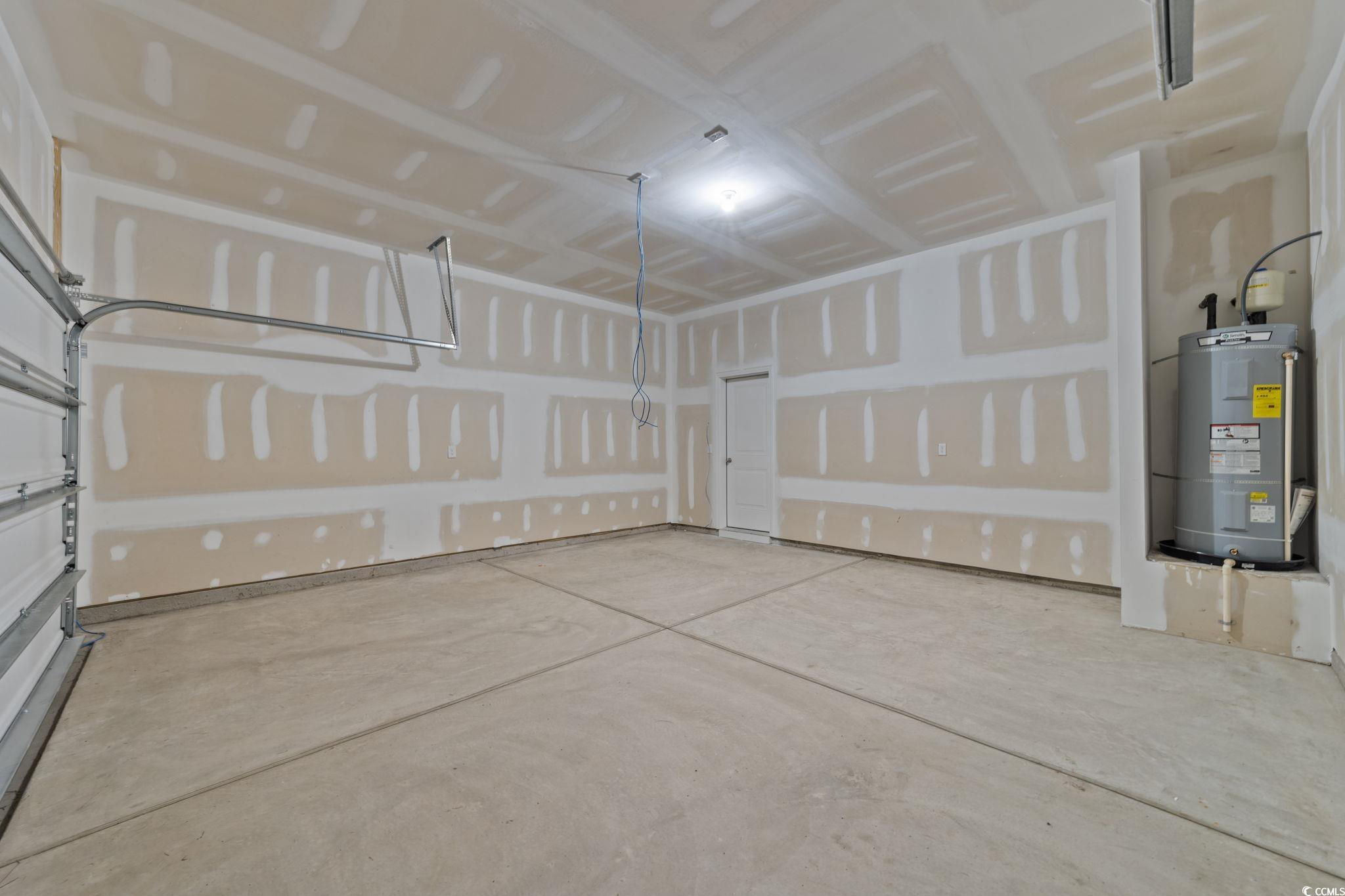 771 Ebb Tide Road Little River, SC 29566 - Photo 20 of 35 Garage featuring electric water heater