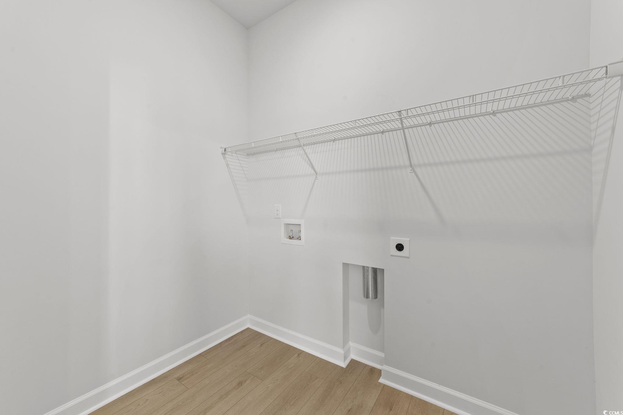 771 Ebb Tide Road Little River, SC 29566 - Photo 25 of 35 Laundry area with light wood-type flooring, hookup for a washing machine, and electric dryer hookup