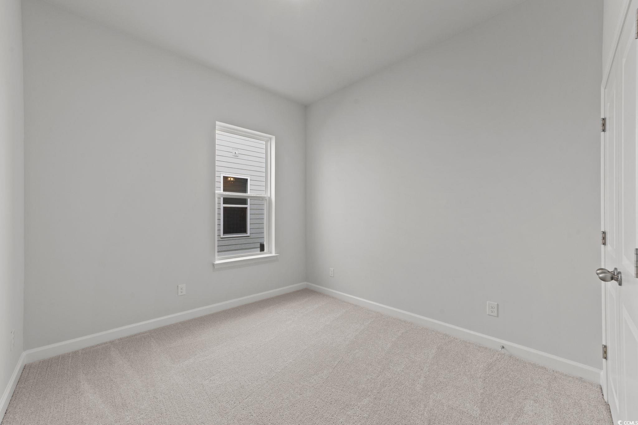 771 Ebb Tide Road Little River, SC 29566 - Photo 33 of 35 Unfurnished room with baseboards and light carpet