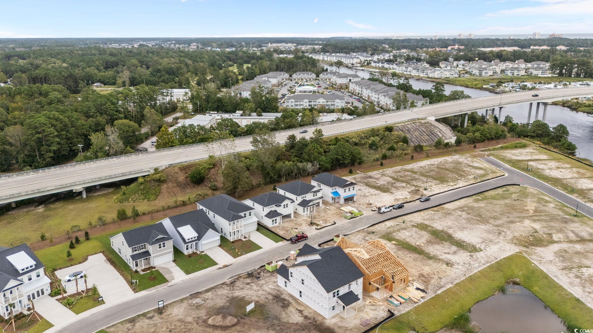 771 Ebb Tide Road Little River, SC 29566 - Photo 10 of 35 Aerial perspective of suburban area featuring a notable bridge