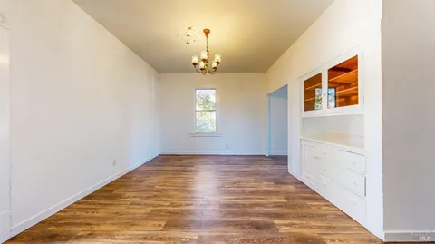 a kitchen with granite countertop a stove and a refrigerator