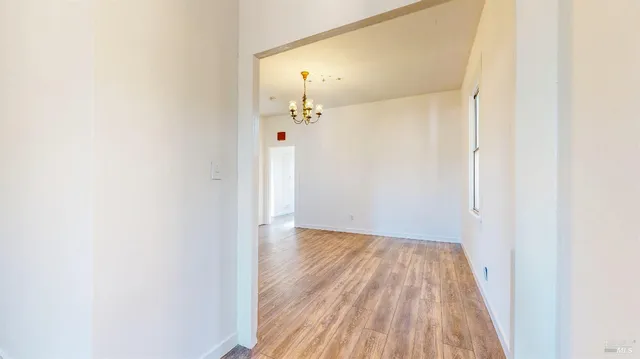 a view of bedroom with wooden floor