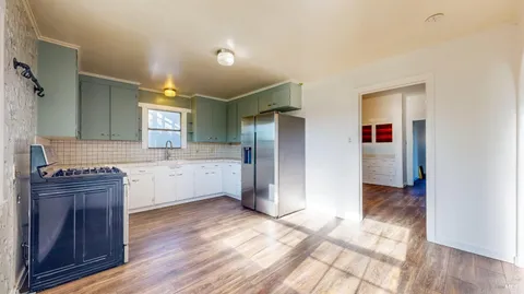 a view of hallway with wooden floor