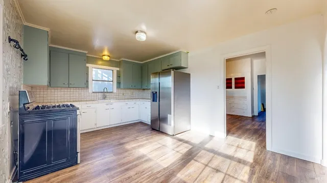 a view of hallway with wooden floor