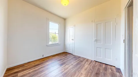a view of a room with wooden walls