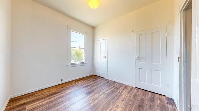 a view of a room with wooden walls