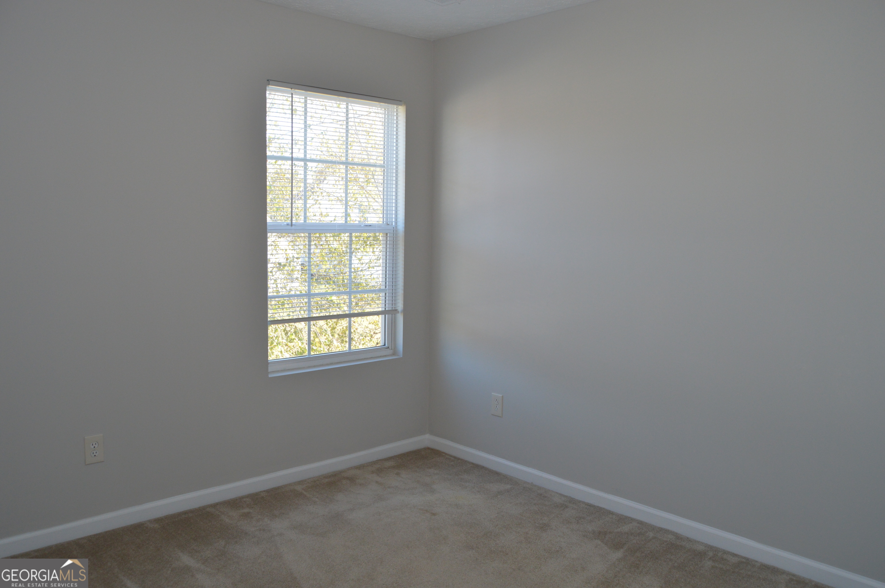 5765 Ridge Stone Way Cumming, GA 30041 - Photo 19 of 22 an empty room with a window