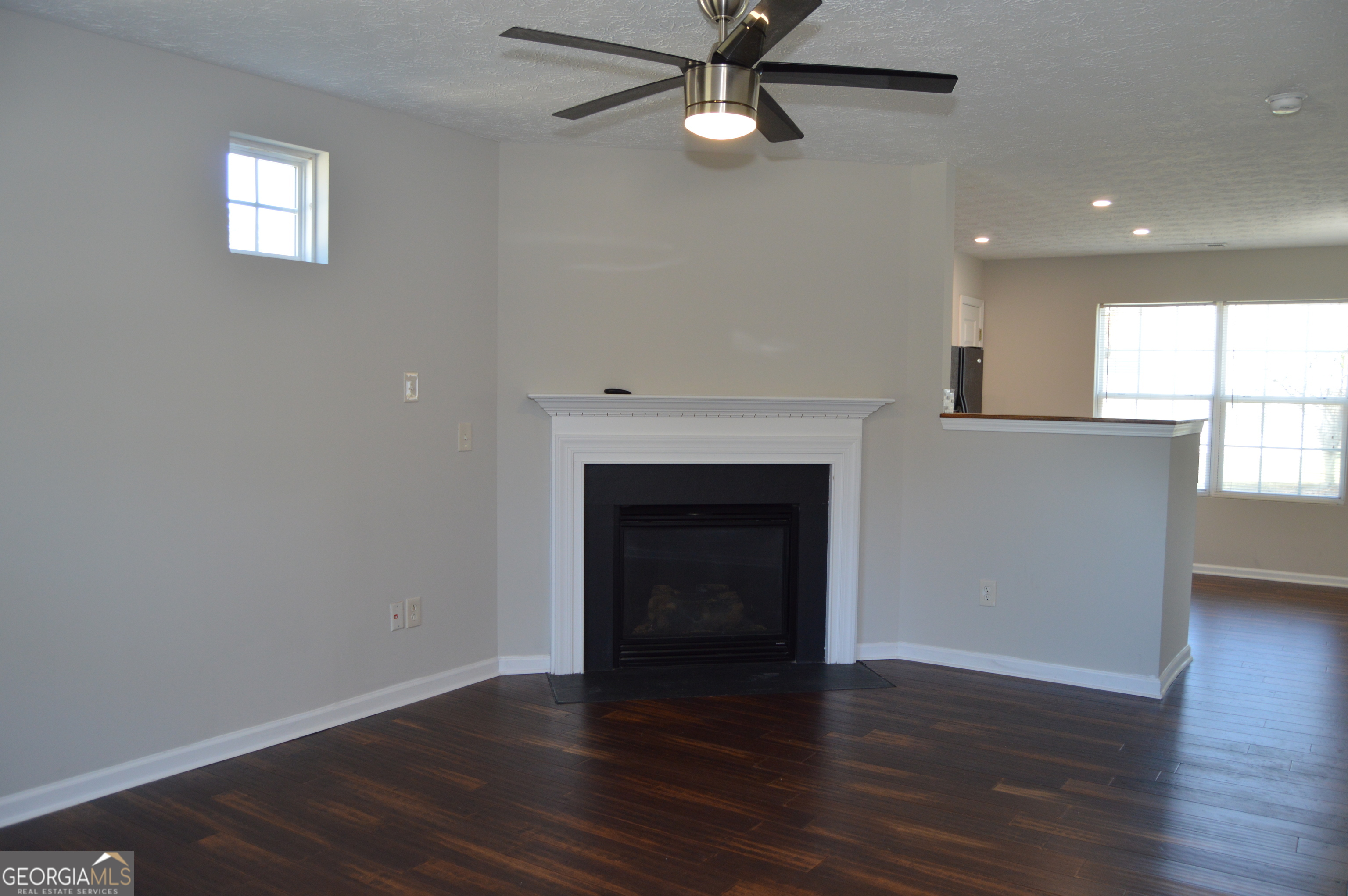 5765 Ridge Stone Way Cumming, GA 30041 - Photo 22 of 22 a view of an empty room with wooden floor and a window