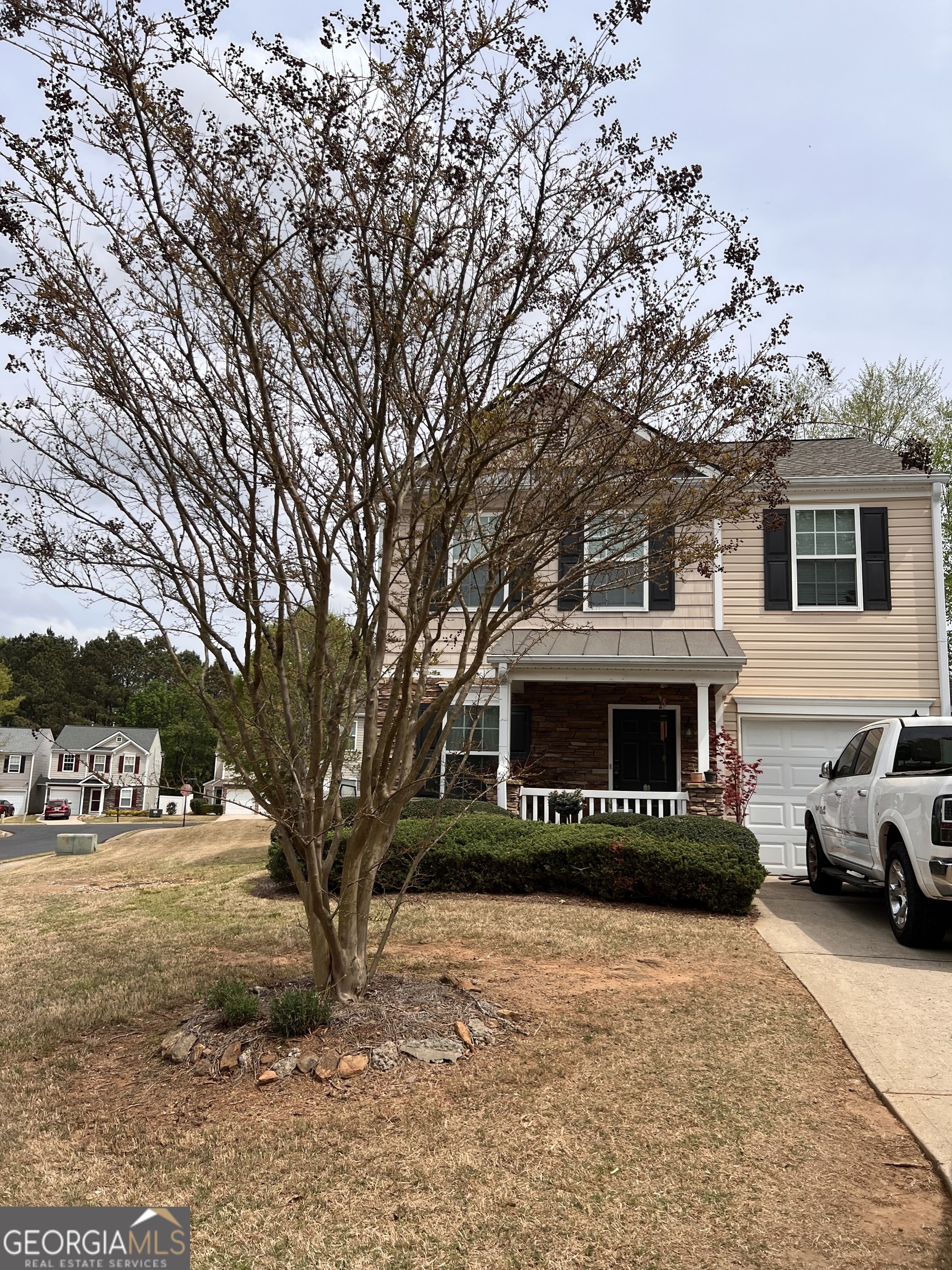5765 Ridge Stone Way Cumming, GA 30041 - Photo 4 of 22 a view of a house with a yard