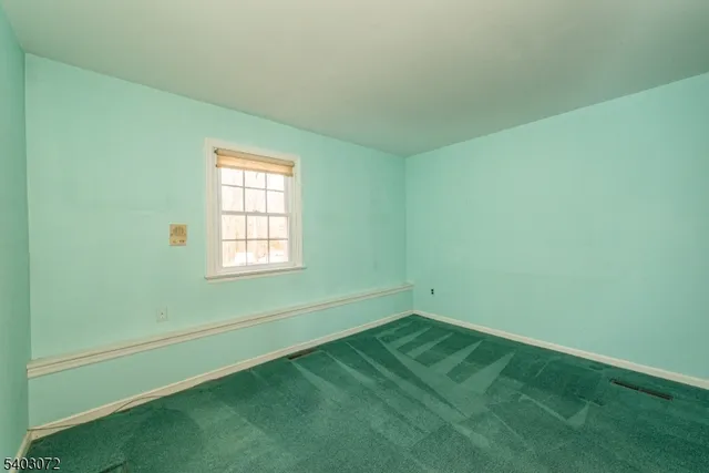 a view of a room with windows