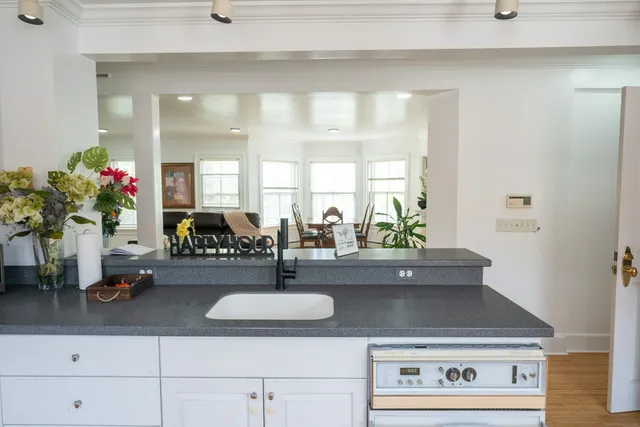 a view of living room with furniture and potted plant
