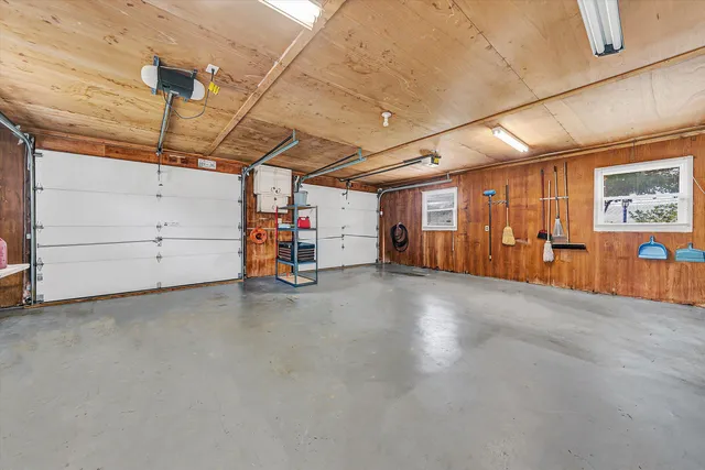 a view of a big room with air conditioner duct and materials on floor