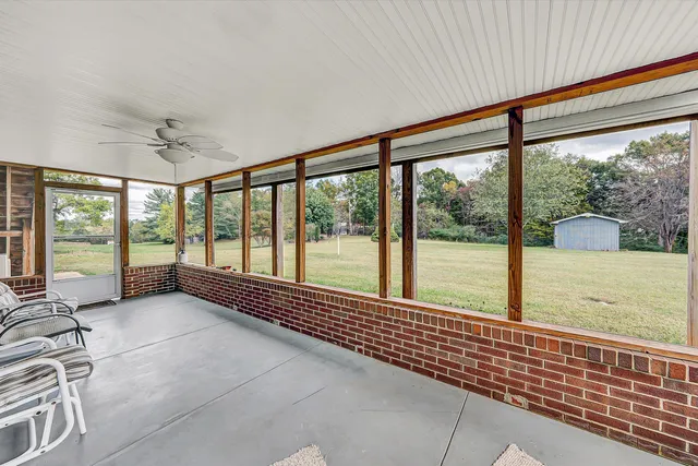 a view of a patio with a table and chairs