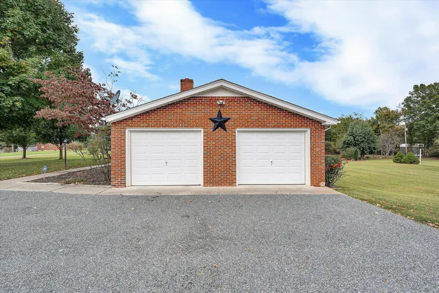 a view of a big yard with an outdoor seating