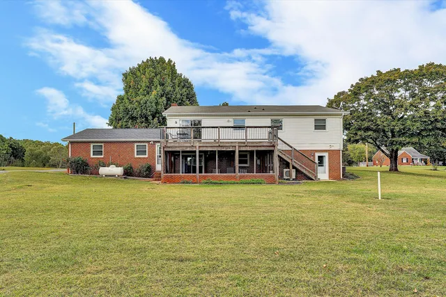 swimming pool view with a garden