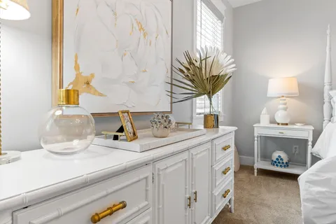 a kitchen with a sink a stove and a mirror