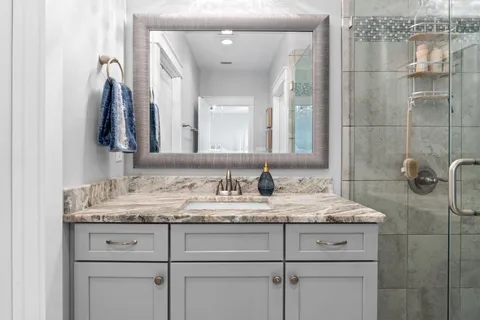 a bathroom with a sink and a mirror